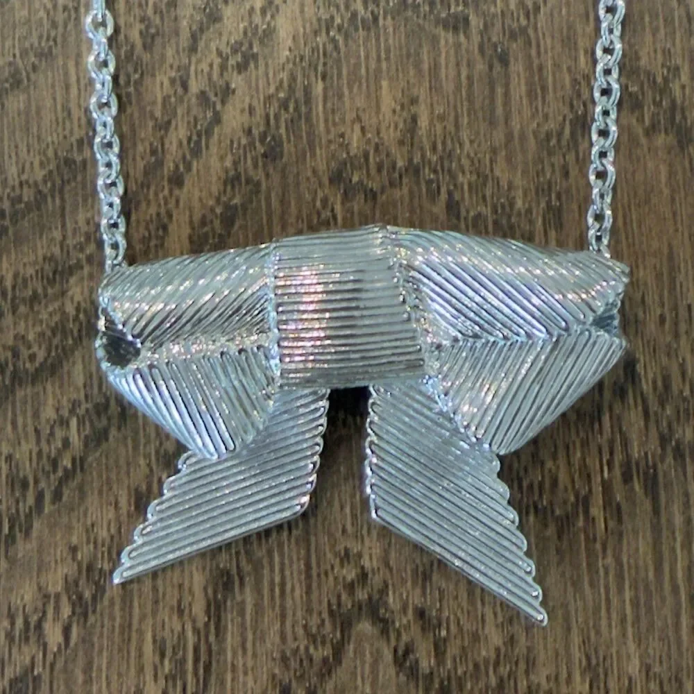 Kate Spade All Wrapped Up Silver Tone Ribbed Grosgrain Ribbon Bow Necklace Charm